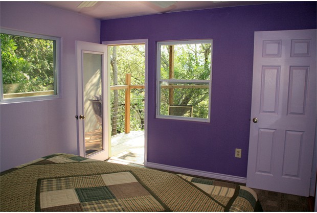 Another view of bedroom with deck access.